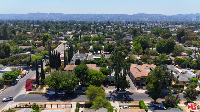 an aerial view of a town with couple of houses