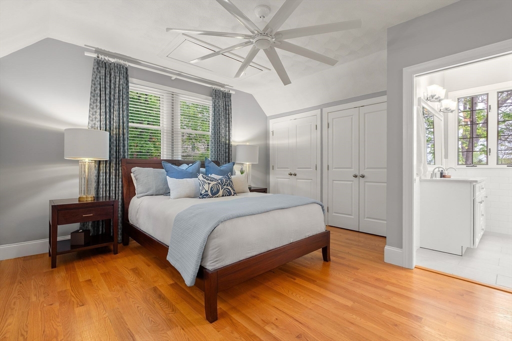 165 Park Avenue, Unit 165 Arlington, MA 02476 - Photo 11 of 32 a bedroom with a bed and a table