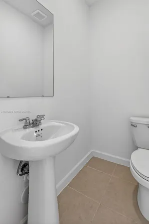a bathroom with a sink and a toilet