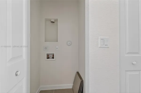 a view of a hallway with a wooden door