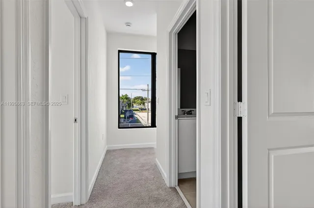 a bathroom with a sink a toilet a mirror a bathtub and shower