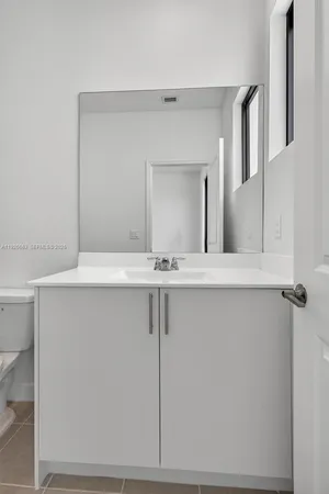 a bathroom with a shower and a toilet