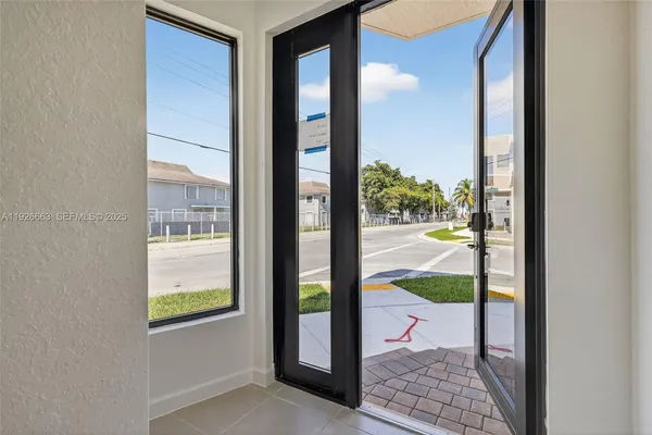 a balcony view with a floor to ceiling window