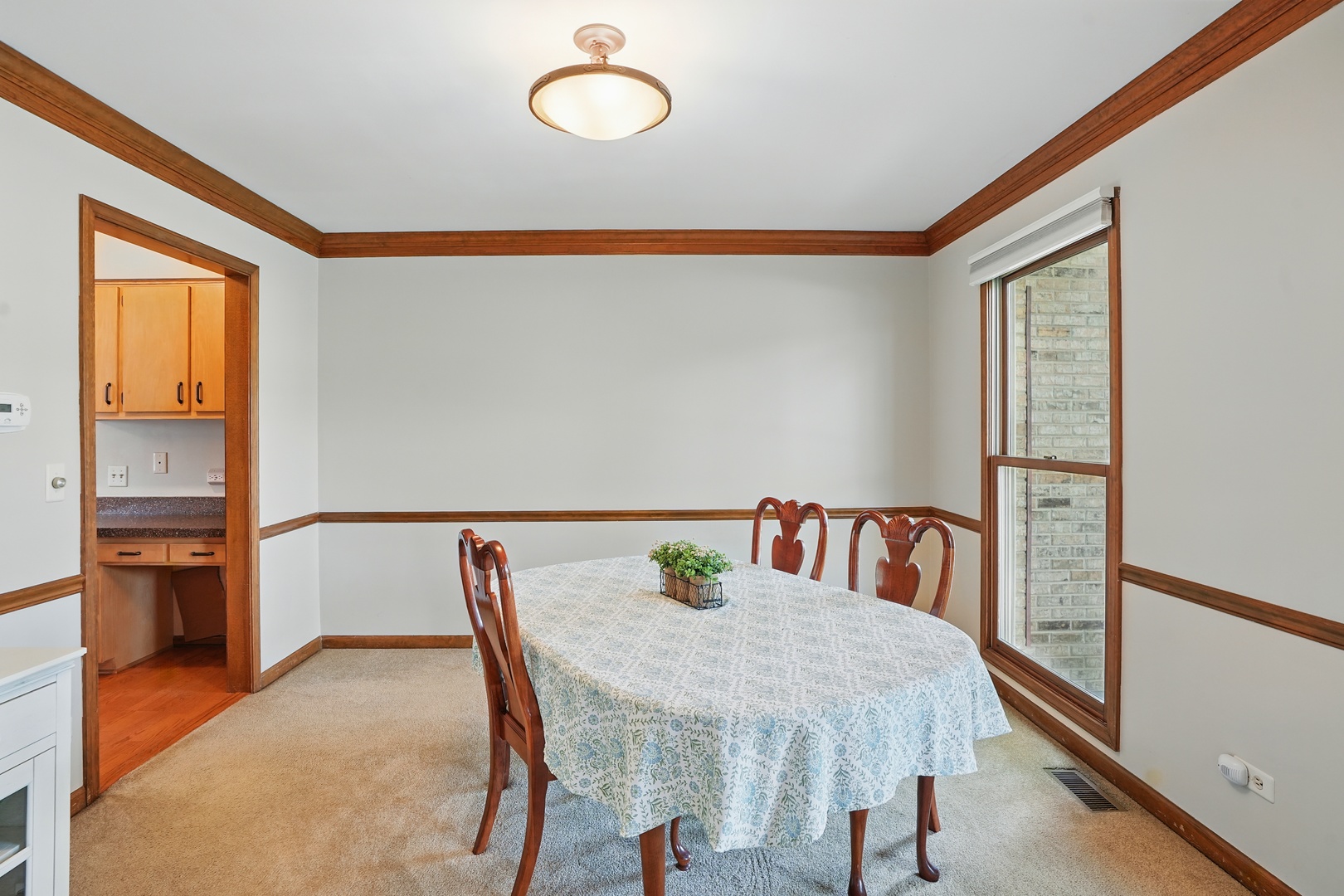 1844 Slippery Rock Road Naperville, IL 60565 - Photo 19 of 39 a view of a dining room with furniture and window