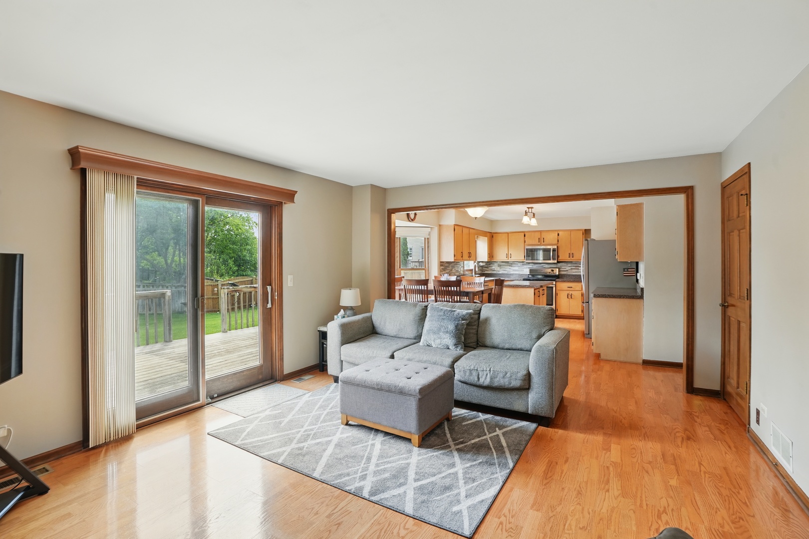 1844 Slippery Rock Road Naperville, IL 60565 - Photo 9 of 39 a living room with furniture and a large window