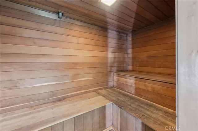 a bathroom with a shower and a sink