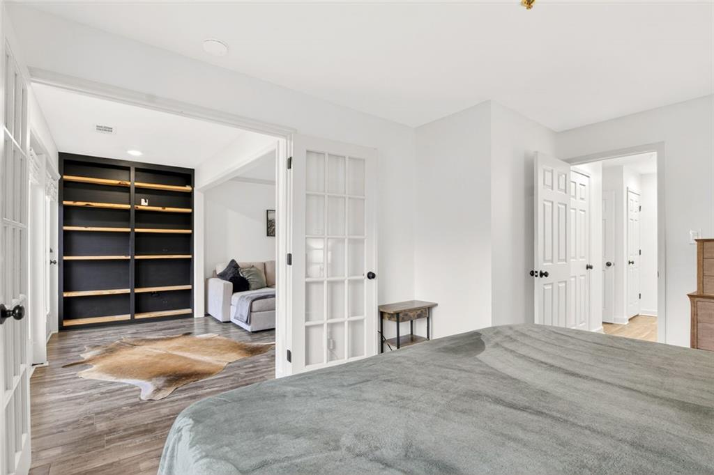 3203 Lenox Road Northeast, Unit 32 Atlanta, GA 30324 - Photo 25 of 38 a bedroom with a bed and closet