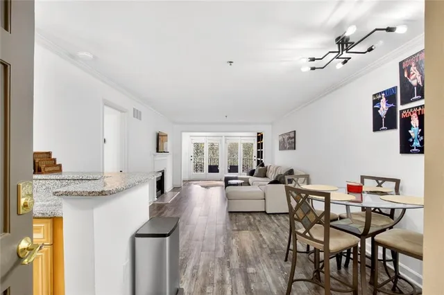 a very nice looking dining room with a table and chairs