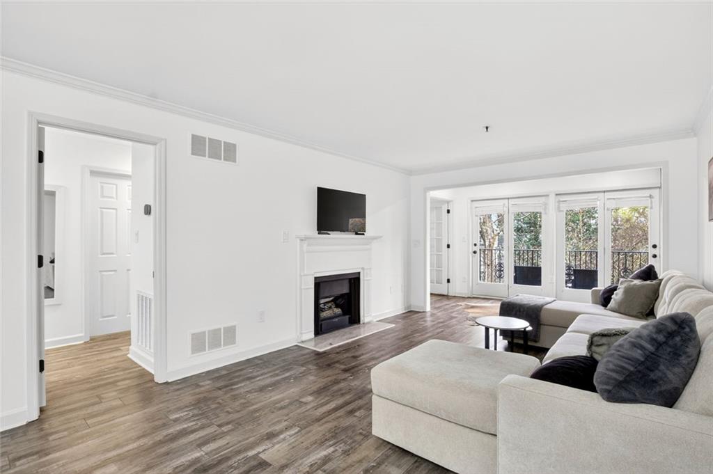 3203 Lenox Road Northeast, Unit 32 Atlanta, GA 30324 - Photo 6 of 38 a living room with furniture and a fireplace