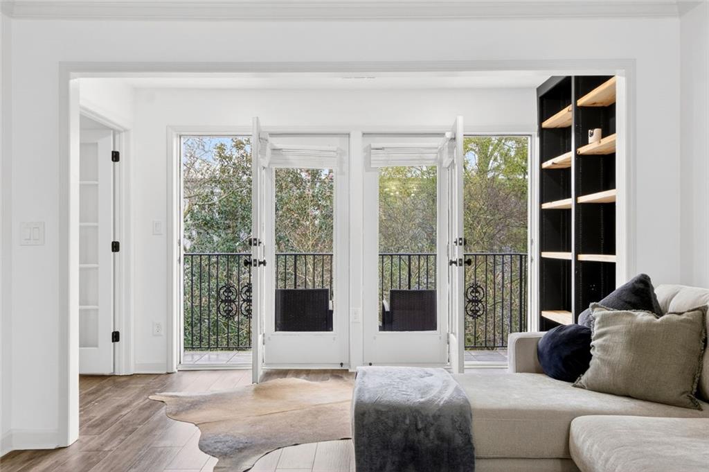 3203 Lenox Road Northeast, Unit 32 Atlanta, GA 30324 - Photo 8 of 38 a living room with furniture and a large window