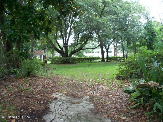 7148 St Augustine Road Jacksonville, FL 32217 - Photo 1 of 2 a view of a yard with plants and trees