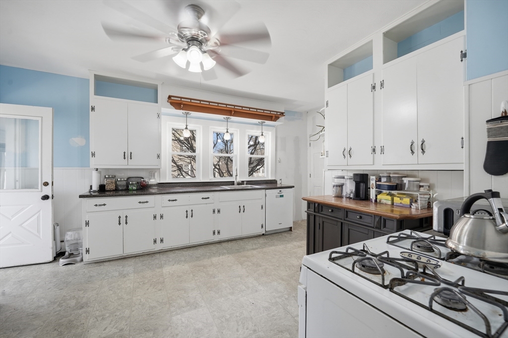 59 Woodmont Street West Springfield, MA 01089 - Photo 12 of 30 a kitchen with stainless steel appliances sink stove and cabinets