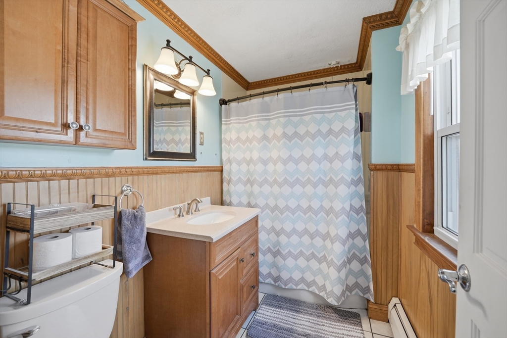 59 Woodmont Street West Springfield, MA 01089 - Photo 16 of 30 a bathroom with a sink and a mirror