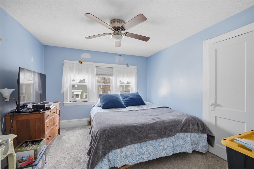 59 Woodmont Street West Springfield, MA 01089 - Photo 17 of 30 a bedroom with a bed and furniture