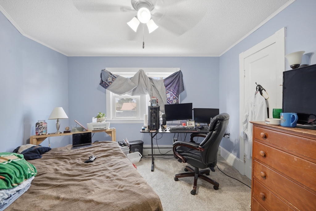 59 Woodmont Street West Springfield, MA 01089 - Photo 23 of 30 a bedroom with a bed and a computer on the desk