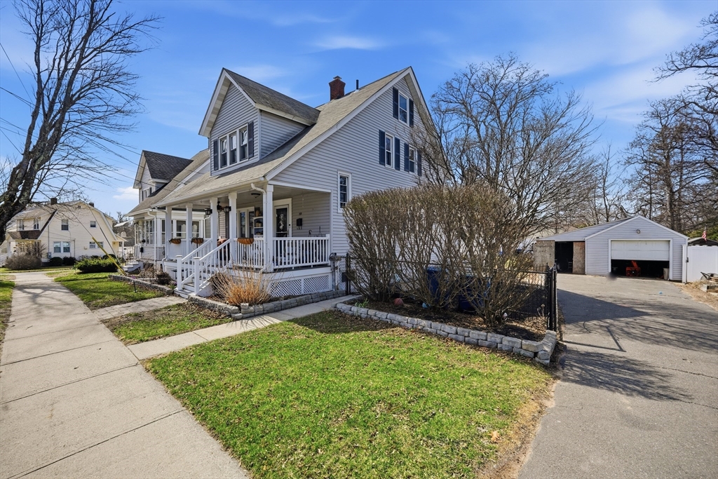 59 Woodmont Street West Springfield, MA 01089 - Photo 4 of 30 a view of a house with a yard and large tree