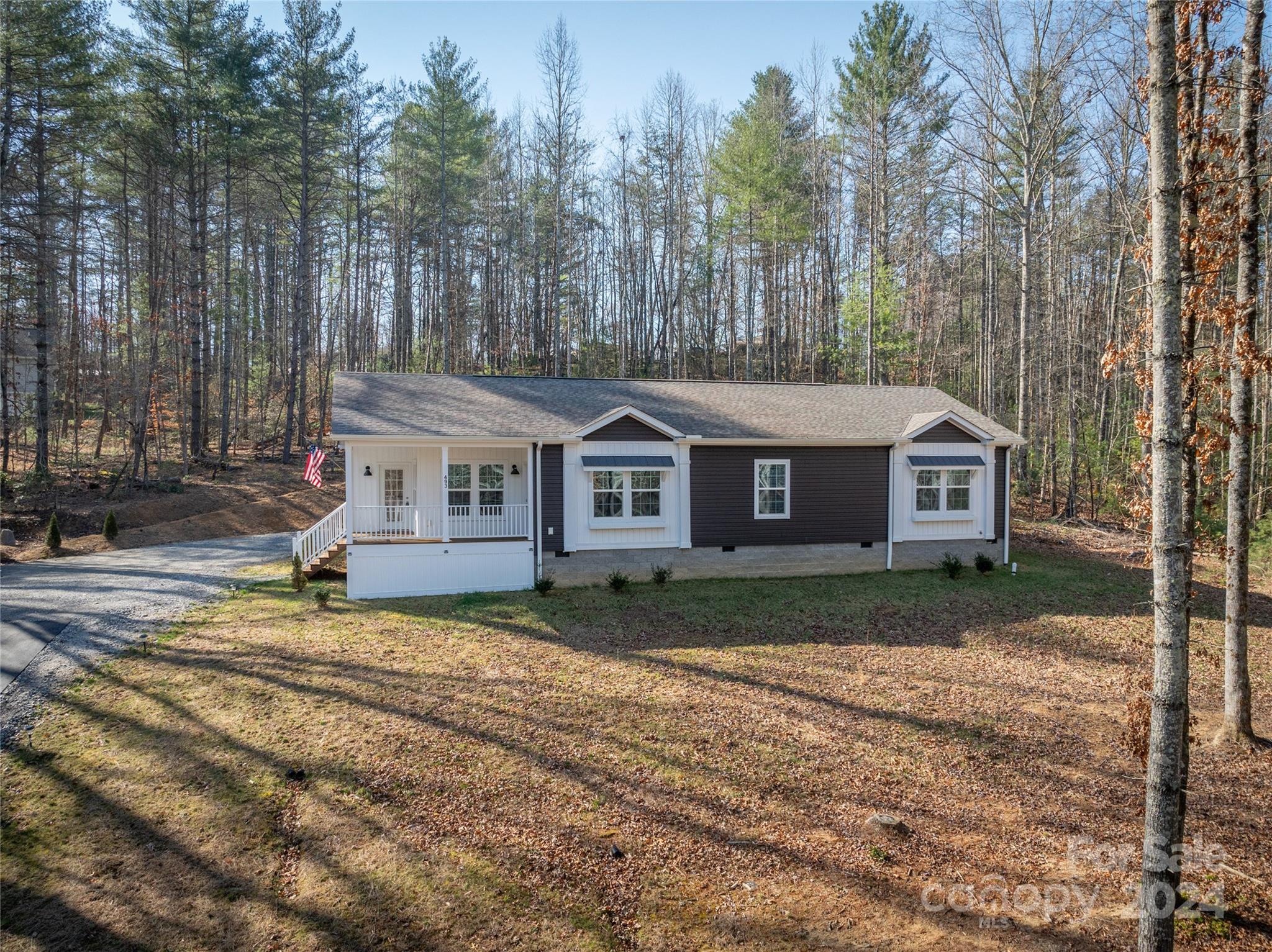 493 Patterson Road Hendersonville, NC 28739 - Photo 17 of 37 a front view of a house with a yard