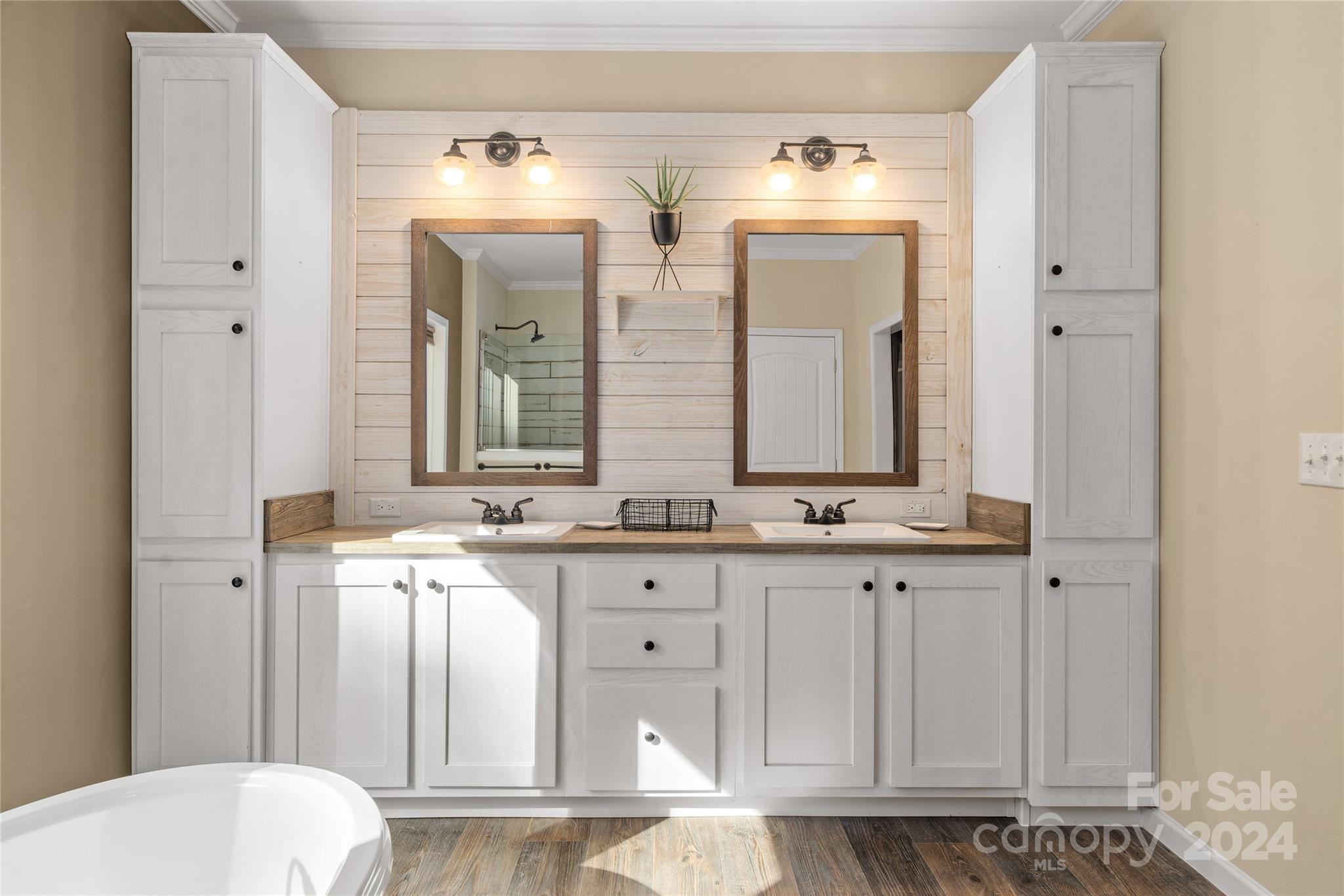 493 Patterson Road Hendersonville, NC 28739 - Photo 32 of 37 a bathroom with double vanity and a mirror
