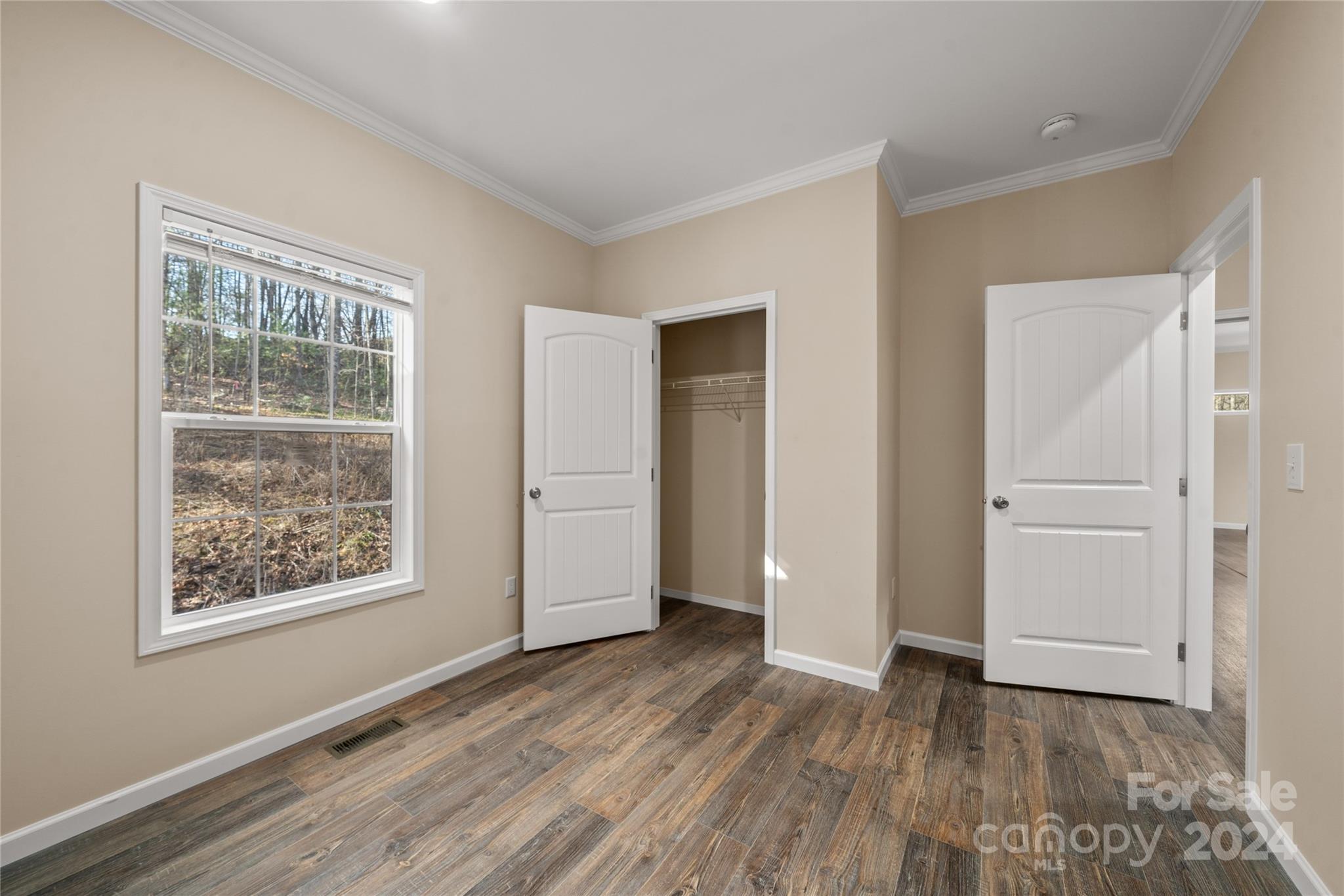 493 Patterson Road Hendersonville, NC 28739 - Photo 36 of 37 a view of an empty room with wooden floor and a window