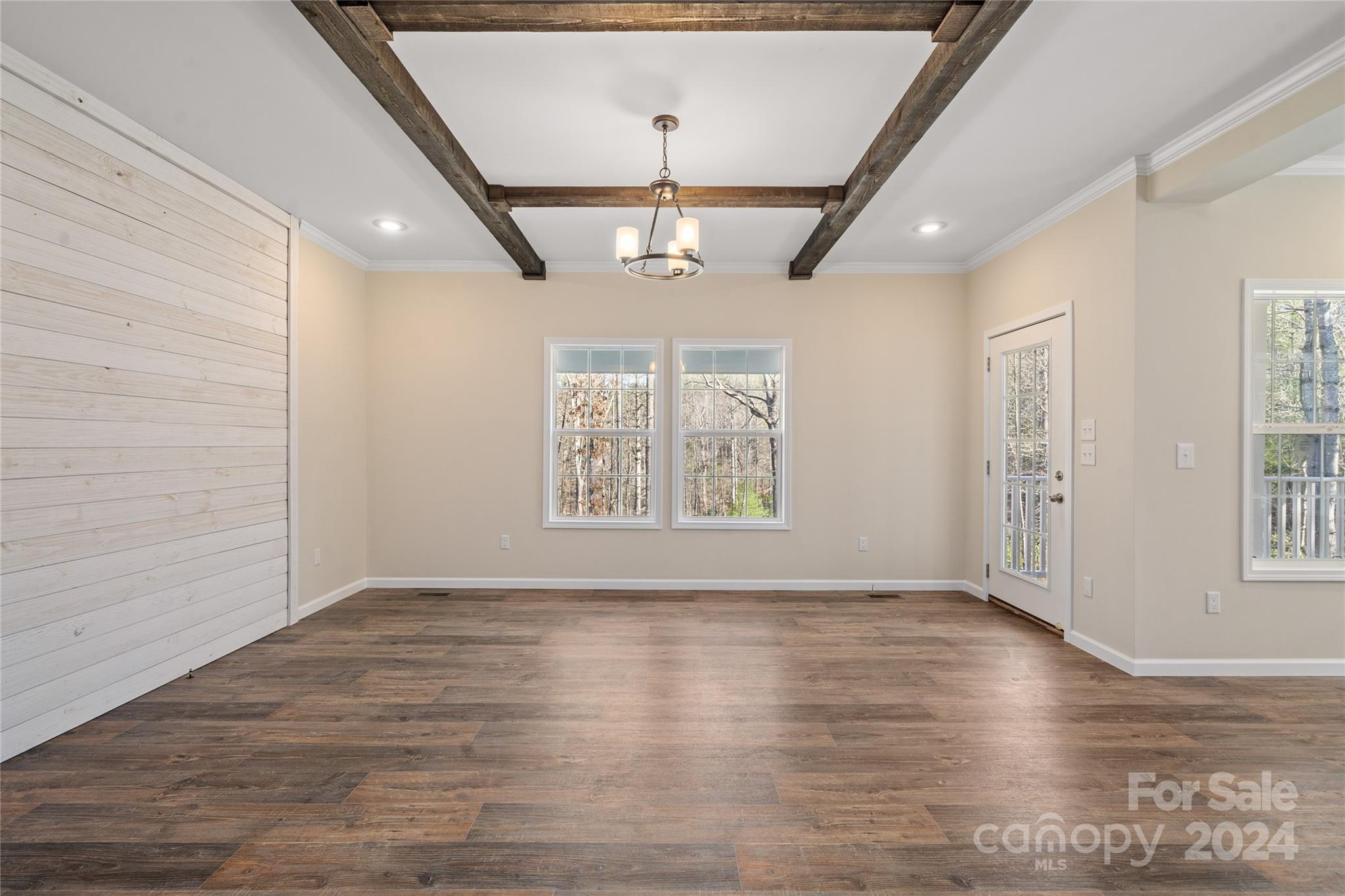 493 Patterson Road Hendersonville, NC 28739 - Photo 6 of 37 a view of an empty room with wooden floor and a window