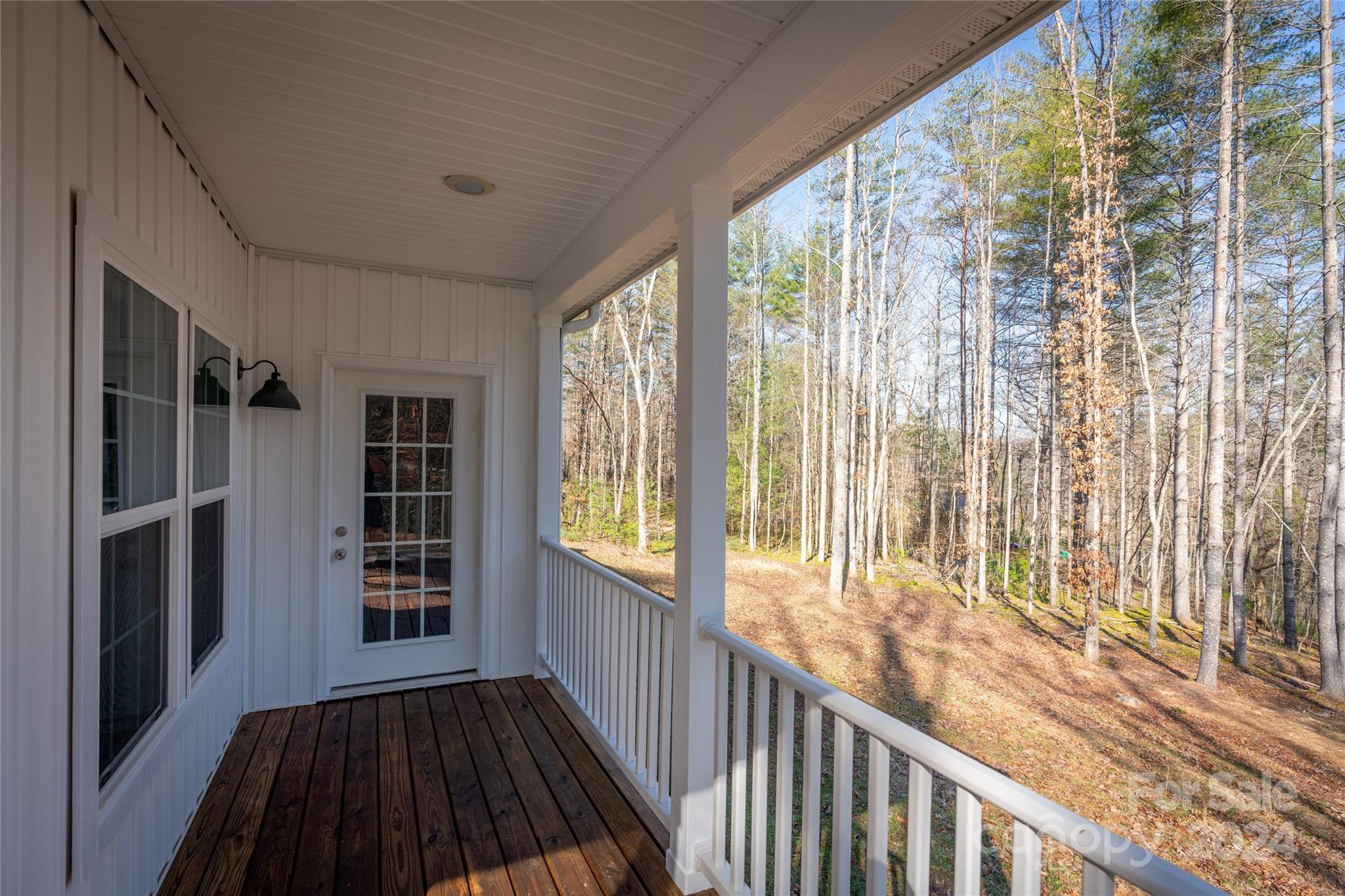 493 Patterson Road Hendersonville, NC 28739 - Photo 10 of 37 a view of a room with wooden floor and windows