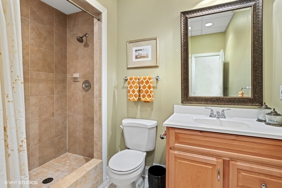 612 North County Line Road Hinsdale, IL 60521 - Photo 28 of 34 a bathroom with a sink a toilet and shower
