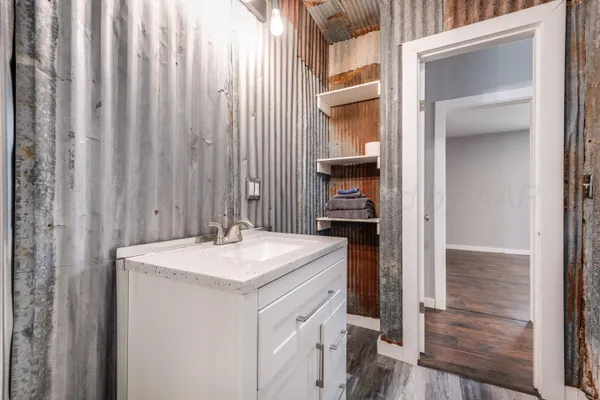 a bathroom with a sink and a mirror