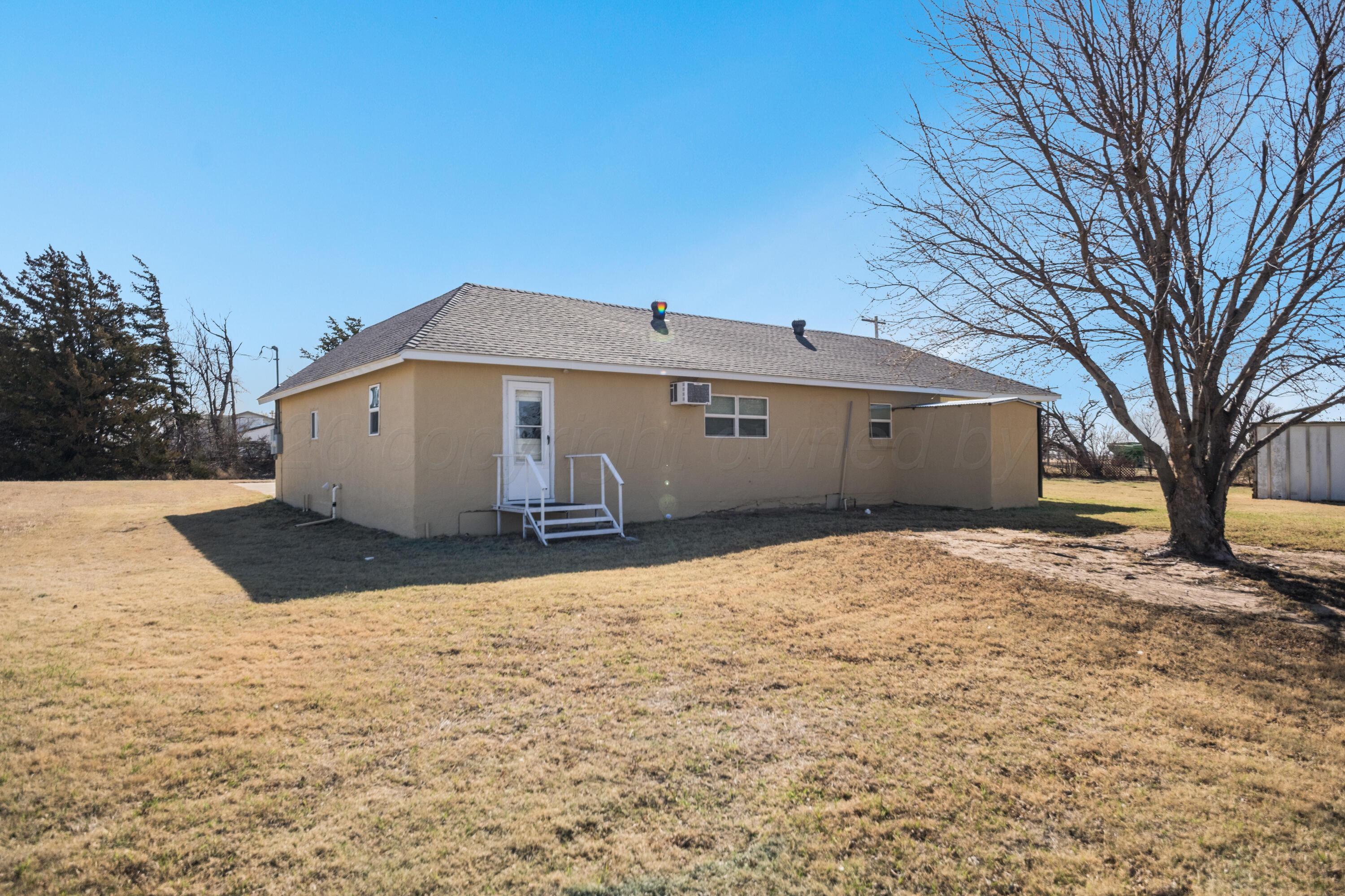 102 Lee Avenue Allison, TX 79011 - Photo 25 of 30 a view of a house with a yard