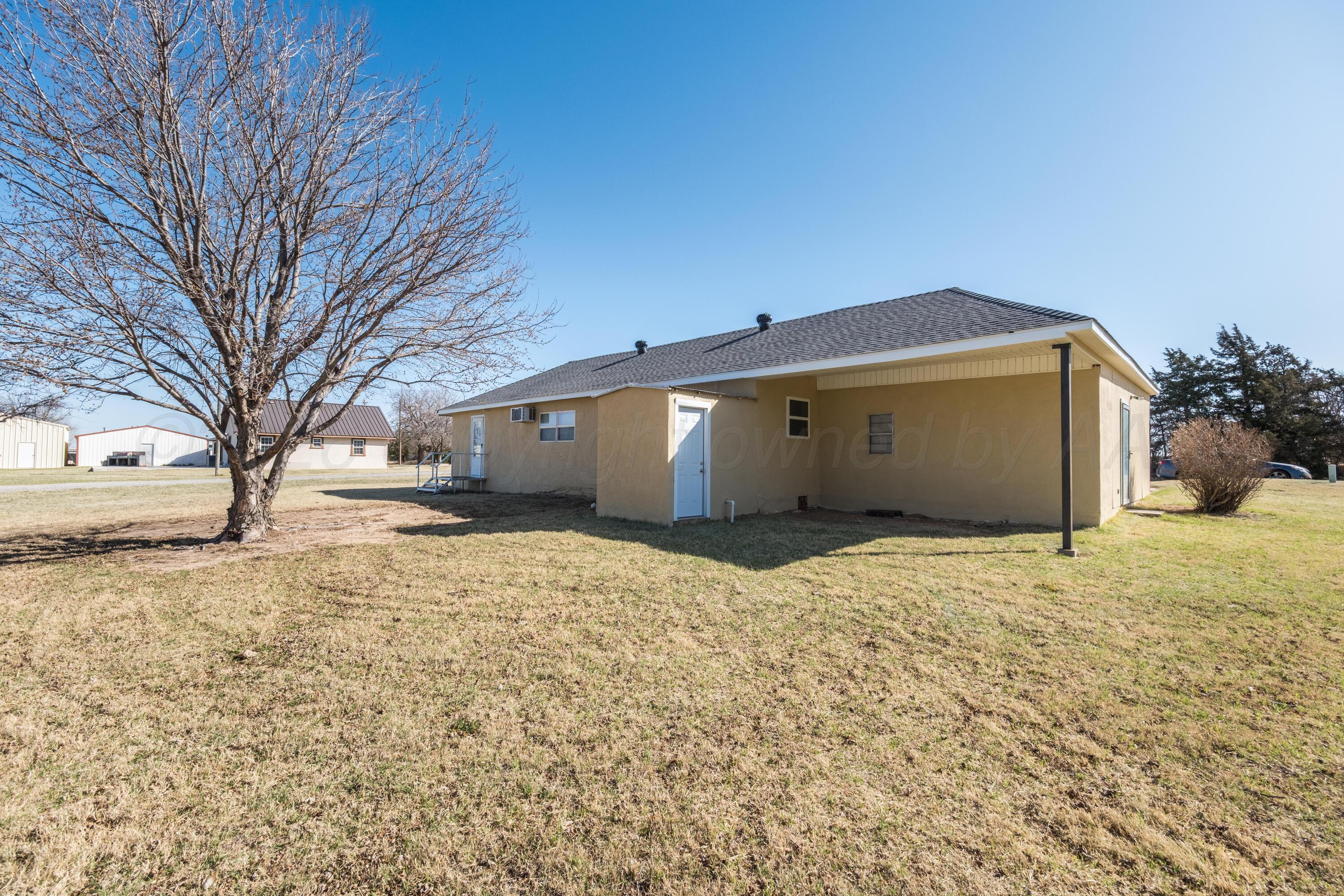 102 Lee Avenue Allison, TX 79011 - Photo 26 of 30 a front view of house with yard covered in snow
