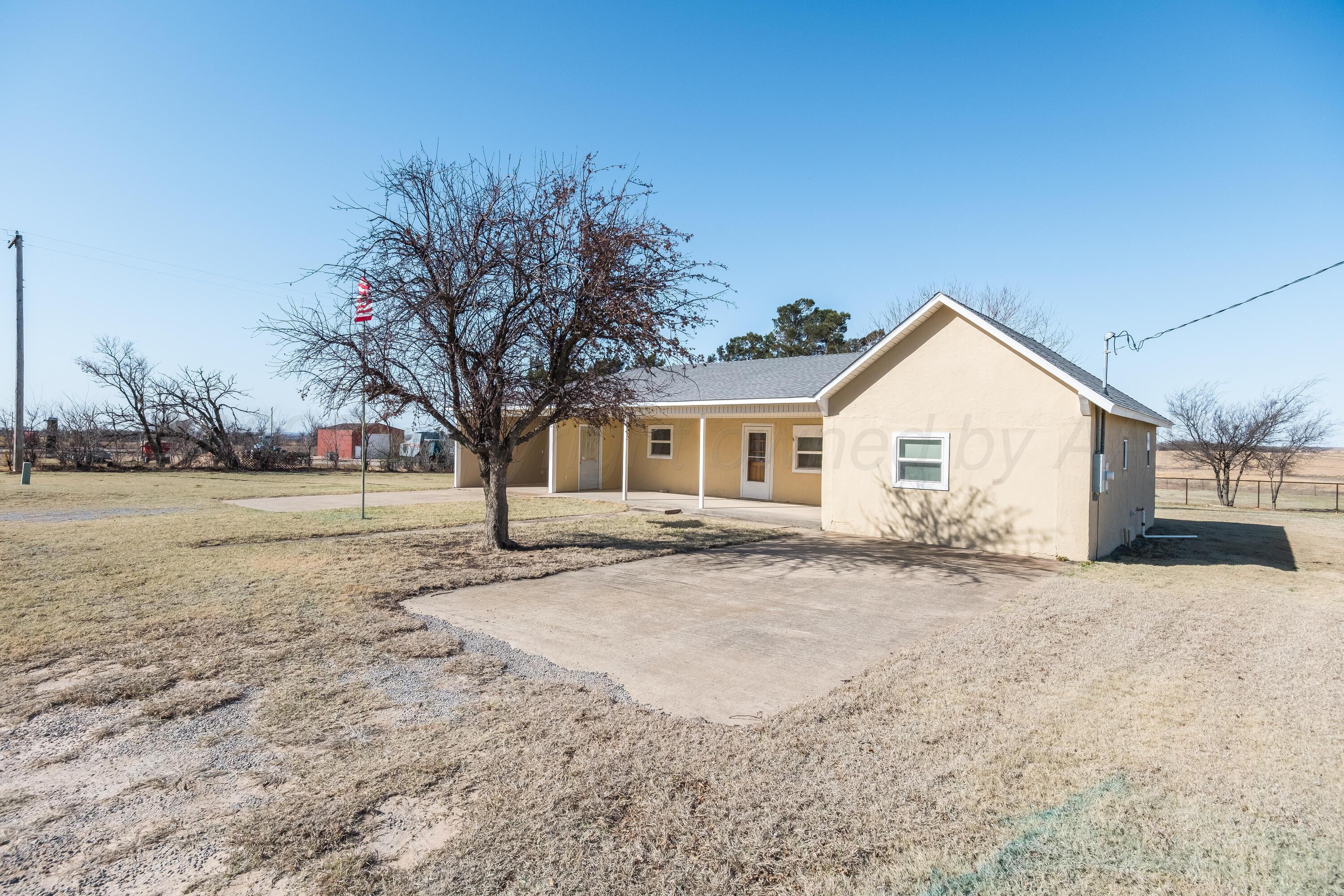 102 Lee Avenue Allison, TX 79011 - Photo 3 of 30 a view of a house with a yard covered with snow