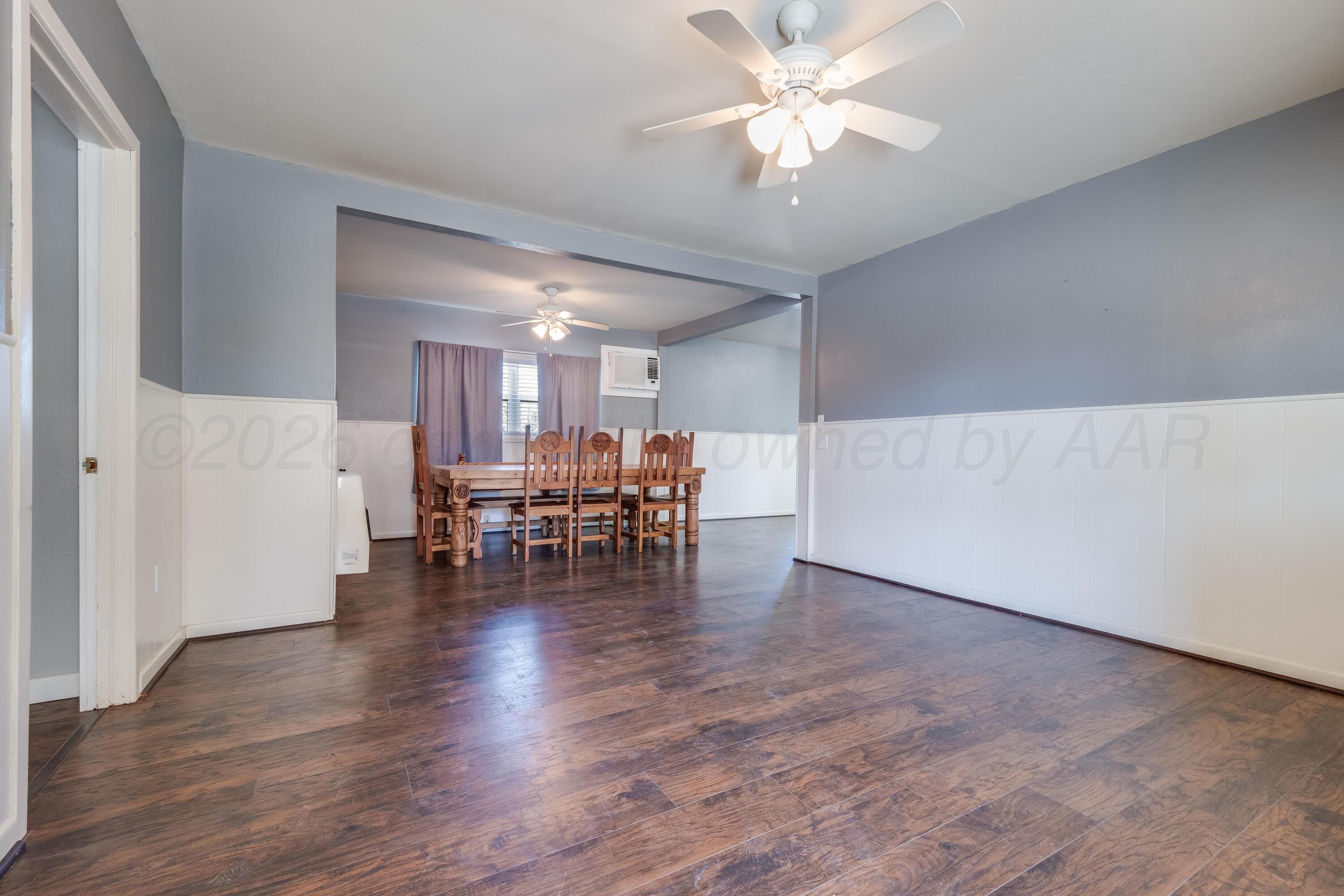102 Lee Avenue Allison, TX 79011 - Photo 5 of 30 a view of dining room with furniture and wooden floor