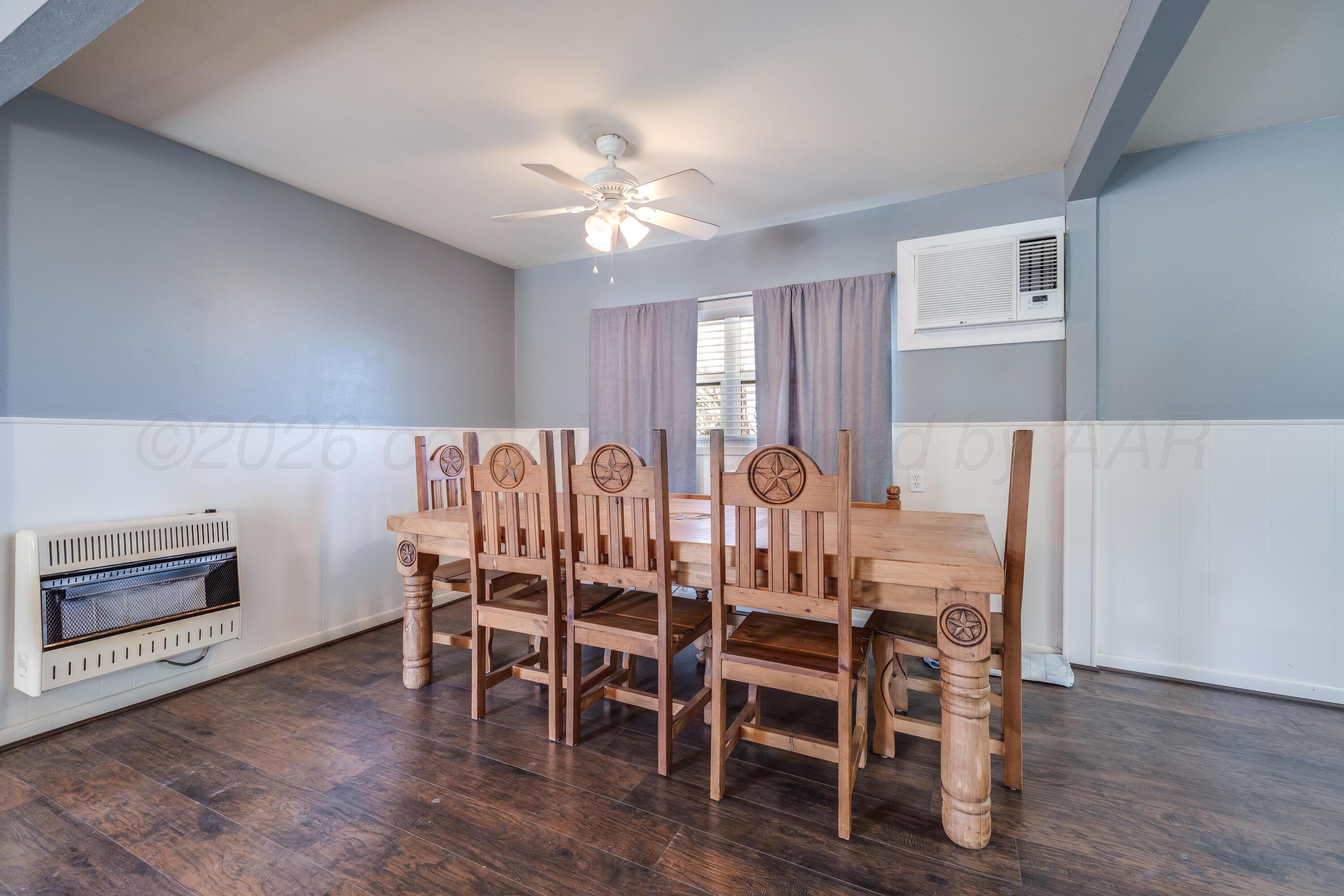 102 Lee Avenue Allison, TX 79011 - Photo 7 of 30 a view of a dining room with furniture and wooden floor
