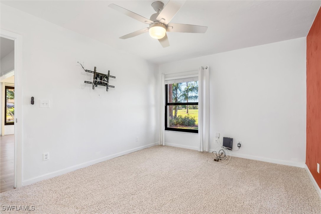 5625 Trailwinds Drive, Unit 412 Fort Myers, FL 33907 - Photo 18 of 40 a view of an empty room and a window
