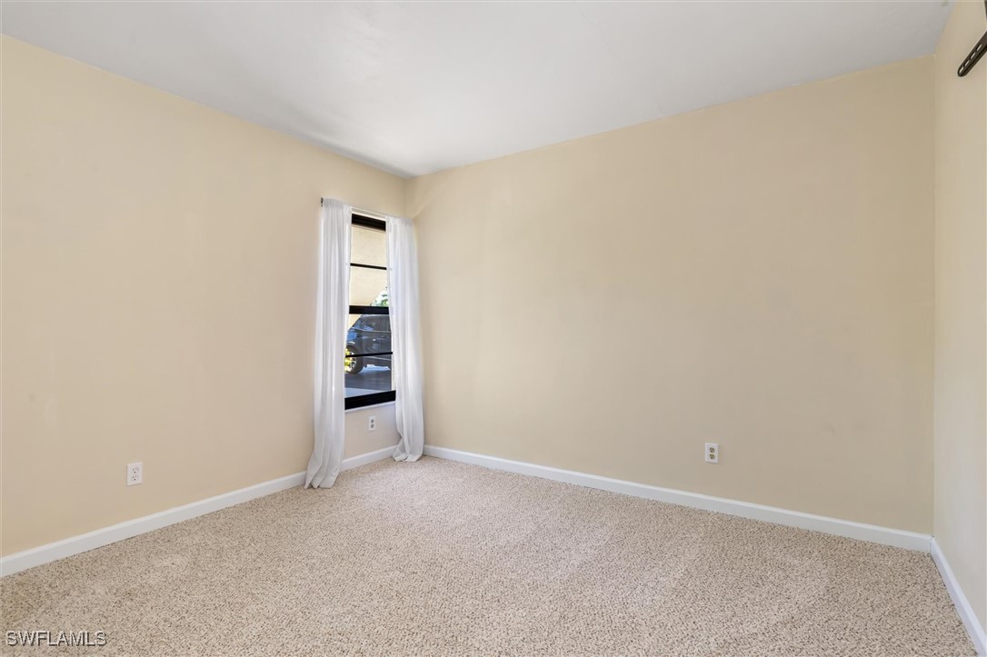 5625 Trailwinds Drive, Unit 412 Fort Myers, FL 33907 - Photo 19 of 40 a view of an empty room and window