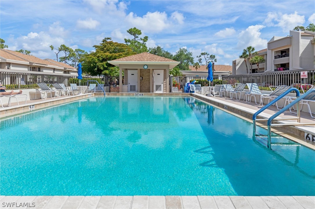 5625 Trailwinds Drive, Unit 412 Fort Myers, FL 33907 - Photo 26 of 40 a view of a swimming pool with a patio