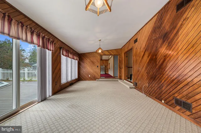a view of a balcony with a ceiling fan