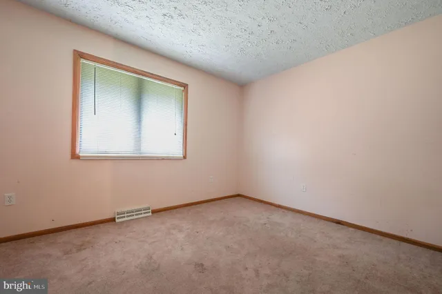 an empty room with a workbench