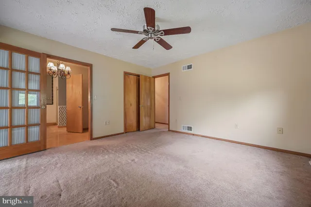 a view of a room with air conditioner and windows