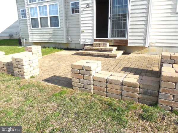 a view of a backyard with sitting area