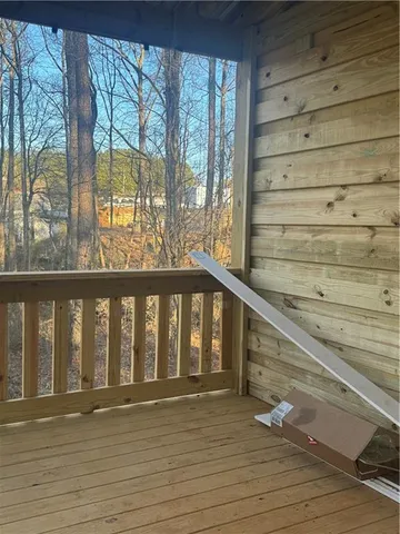 a view of wooden floor with a stairs