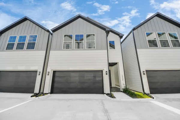 a front view of a house with garage