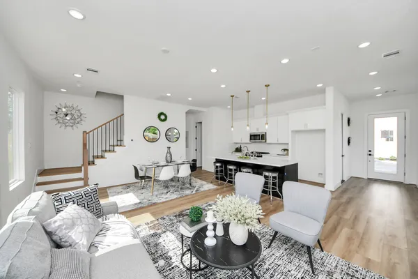 a living room with furniture and a table