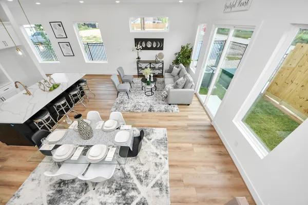 a view of living room with furniture and wooden floor