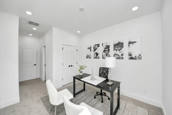a workspace with furniture and wooden floor