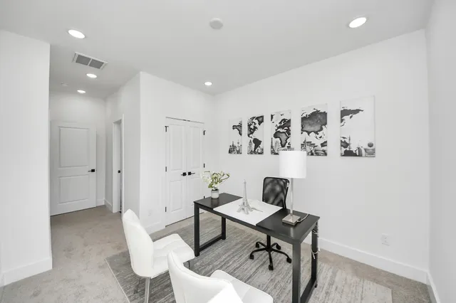 a workspace with furniture and wooden floor