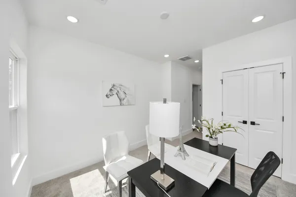 a view of a dining room with furniture