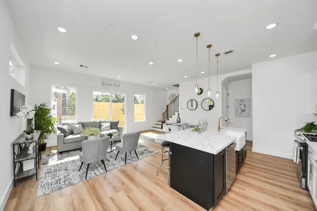 a large kitchen with a table and chairs