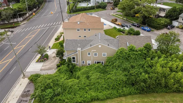 an aerial view of a house with a garden and plants
