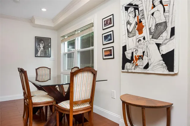 a view of a dinning room with furniture and wooden floor