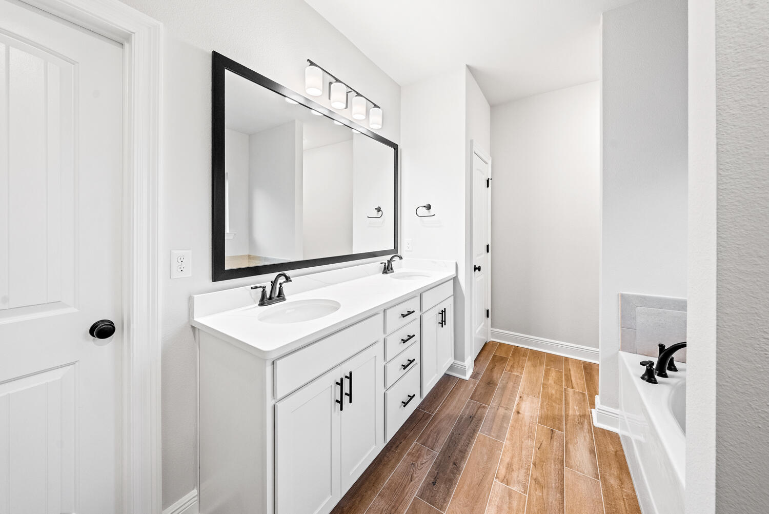 232 West Tweet Street Freeport, FL 32439 - Photo 11 of 23 a bathroom with a sink a mirror and a bathtub